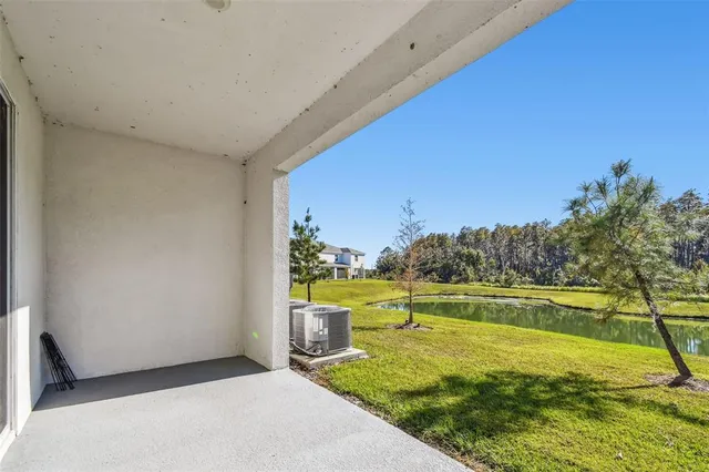 a view of a lake with a house in the background