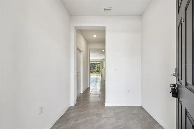 a view of a hallway with a room