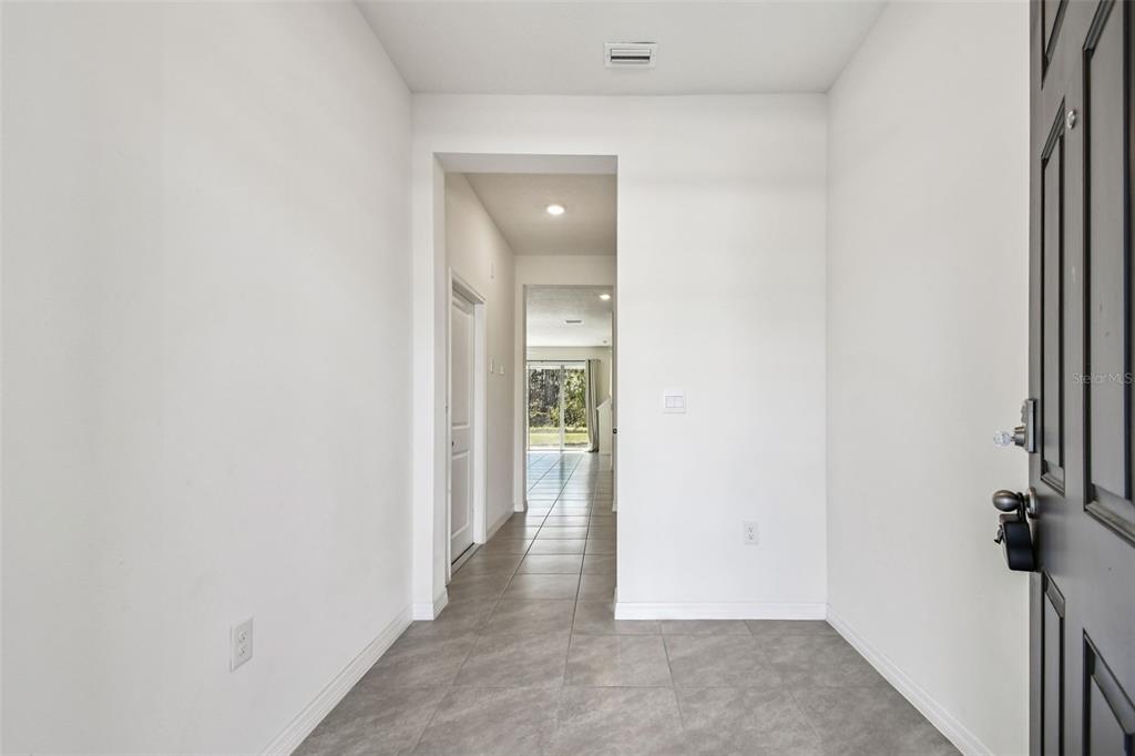 32173 Turtle Grace Loop Wesley Chapel, FL 33545 - Photo 6 of 41 a view of a hallway with a room