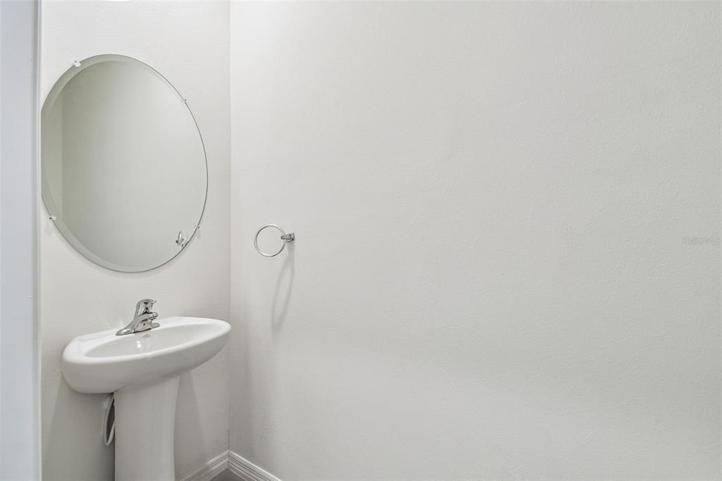 32173 Turtle Grace Loop Wesley Chapel, FL 33545 - Photo 7 of 41 a bathroom with a sink and a mirror