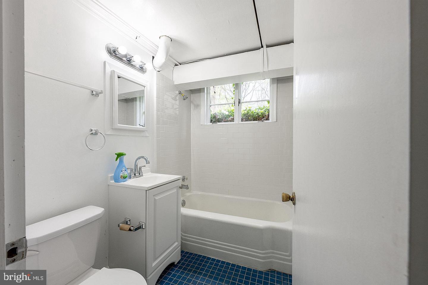 9120 Levelle Drive Chevy Chase, MD 20815 - Photo 13 of 17 a bathroom with a sink a toilet and shower