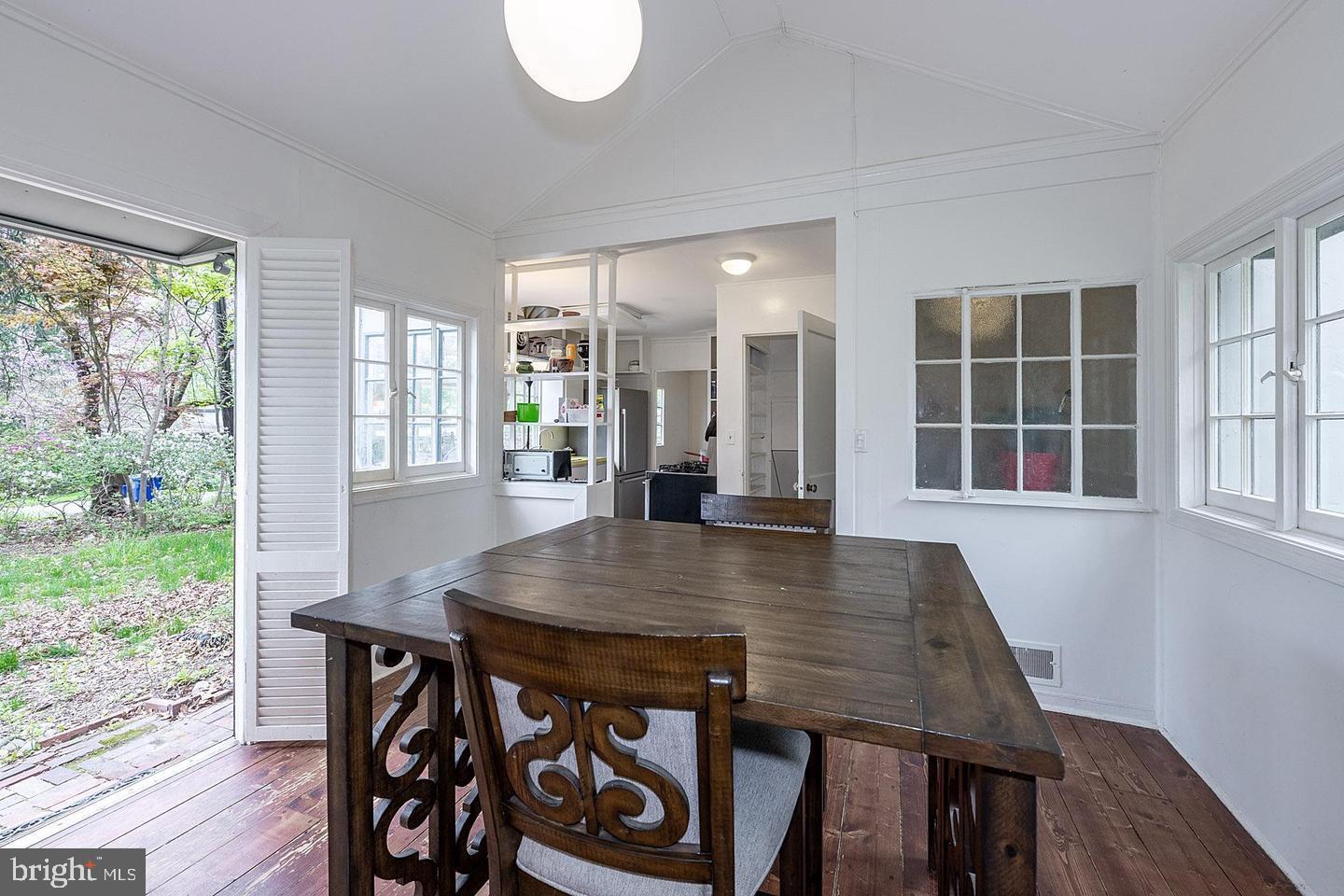 9120 Levelle Drive Chevy Chase, MD 20815 - Photo 3 of 17 a view of a dining room with furniture window and wooden floor