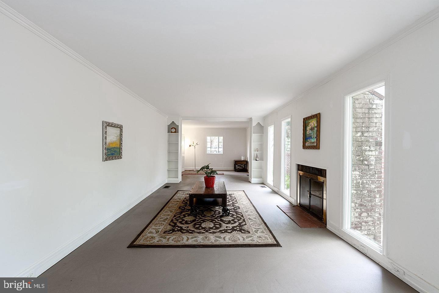 9120 Levelle Drive Chevy Chase, MD 20815 - Photo 5 of 17 a living room with furniture and a fireplace