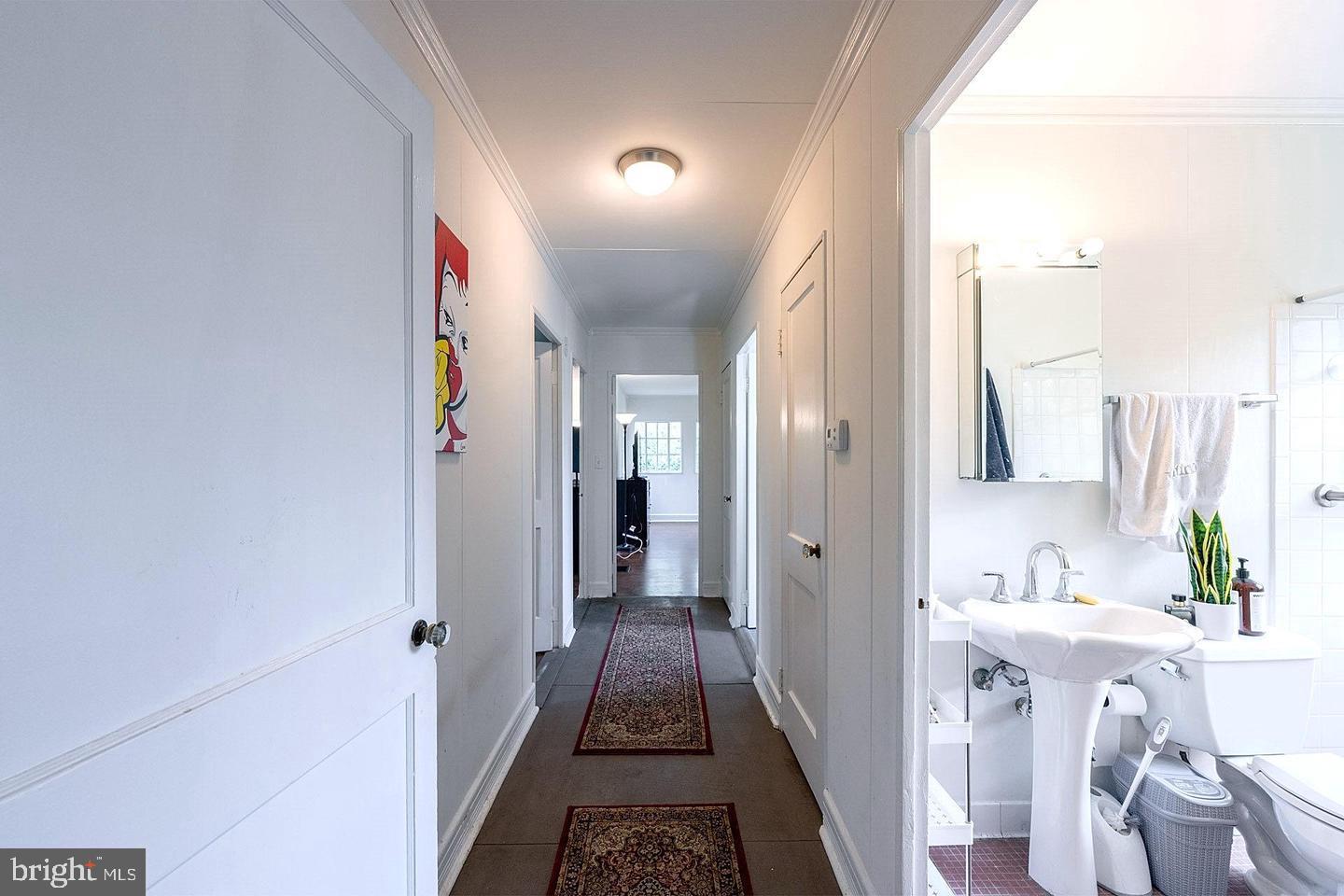 9120 Levelle Drive Chevy Chase, MD 20815 - Photo 6 of 17 a bathroom with a sink and a mirror