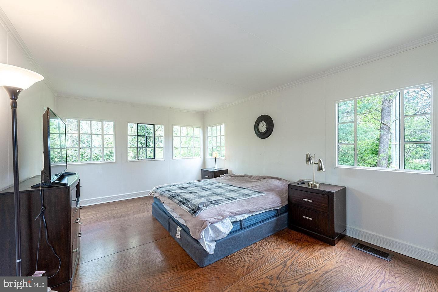 9120 Levelle Drive Chevy Chase, MD 20815 - Photo 7 of 17 a bed room with a bed and a television