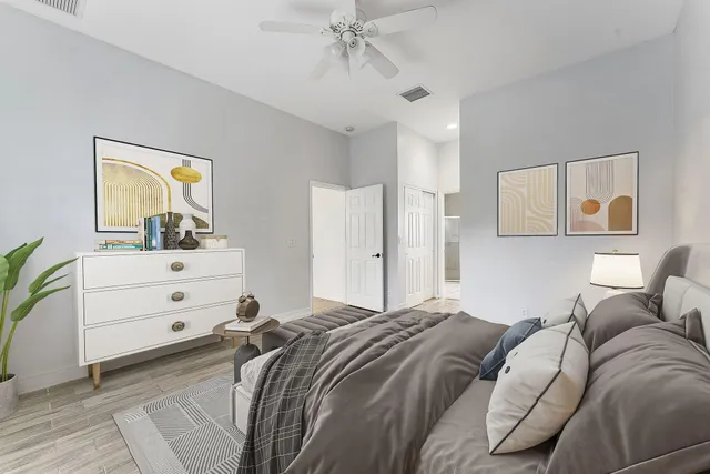 a bed room with a bed and a window