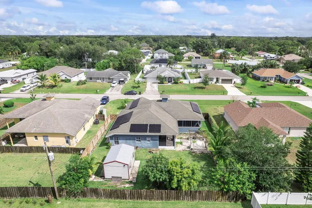 an aerial view of a house with a garden