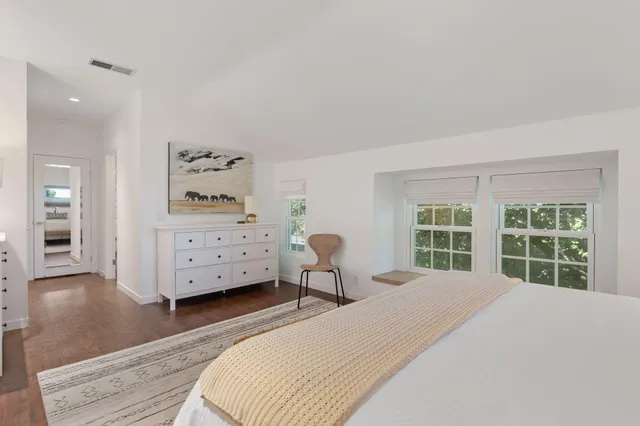 a bathroom with a shower a toilet and a sink