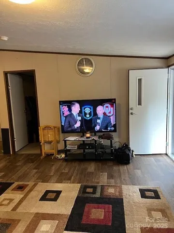 a room with furniture and a flat screen tv