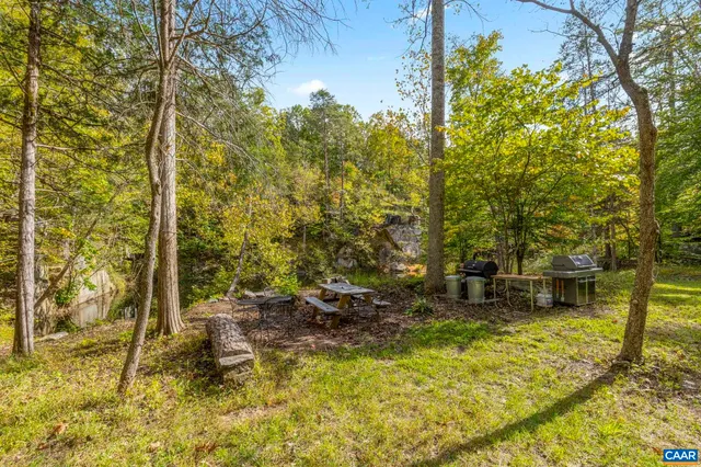 a view of a large body of water with a mountain view