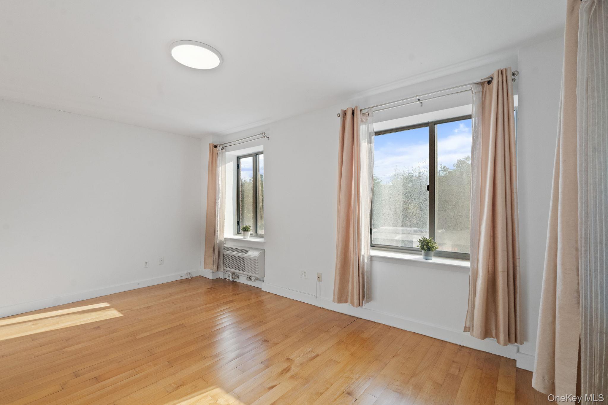 2360 Amsterdam Avenue, Unit 2C Manhattan, NY 10033 - Photo 15 of 29 Spare room with healthy amount of natural light and light wood-type flooring