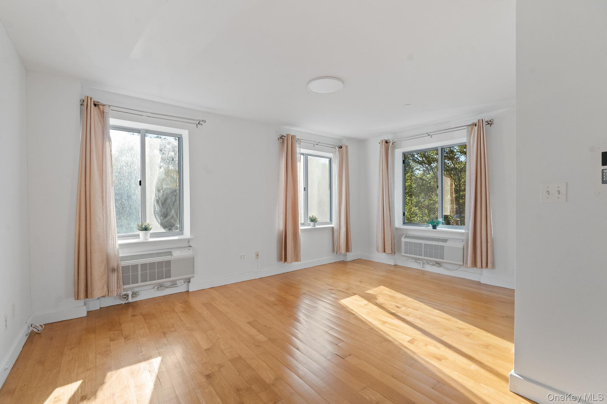 2360 Amsterdam Avenue, Unit 2C Manhattan, NY 10033 - Photo 22 of 29 Spare room with light wood-type flooring and baseboards