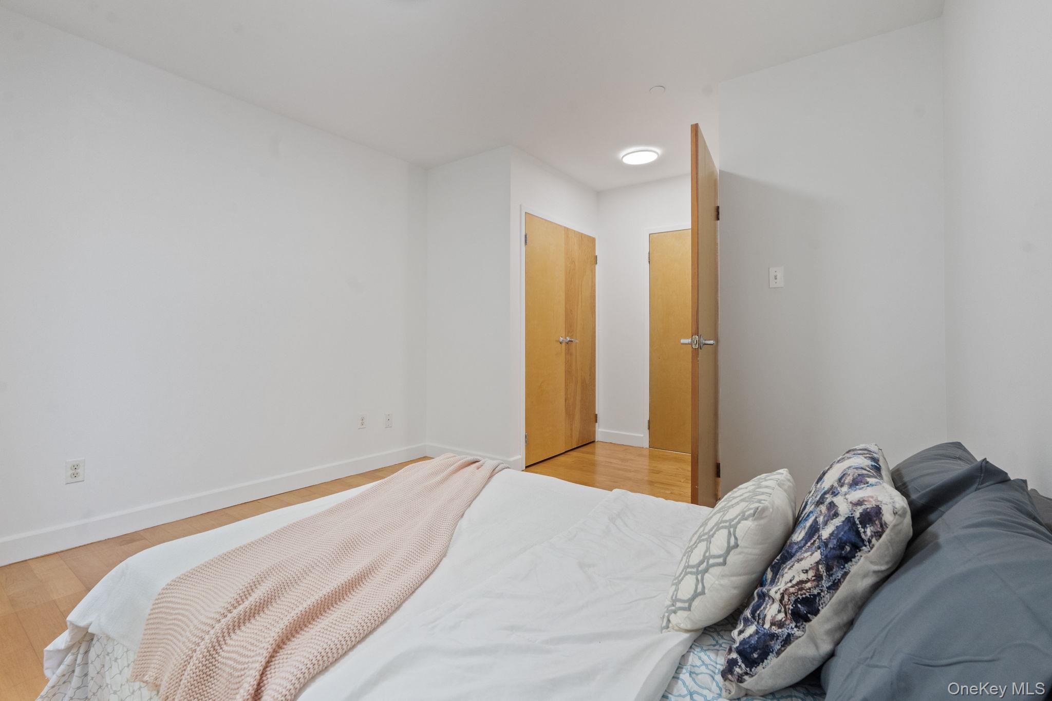 2360 Amsterdam Avenue, Unit 2C Manhattan, NY 10033 - Photo 5 of 29 Bedroom featuring light wood-type flooring and baseboards