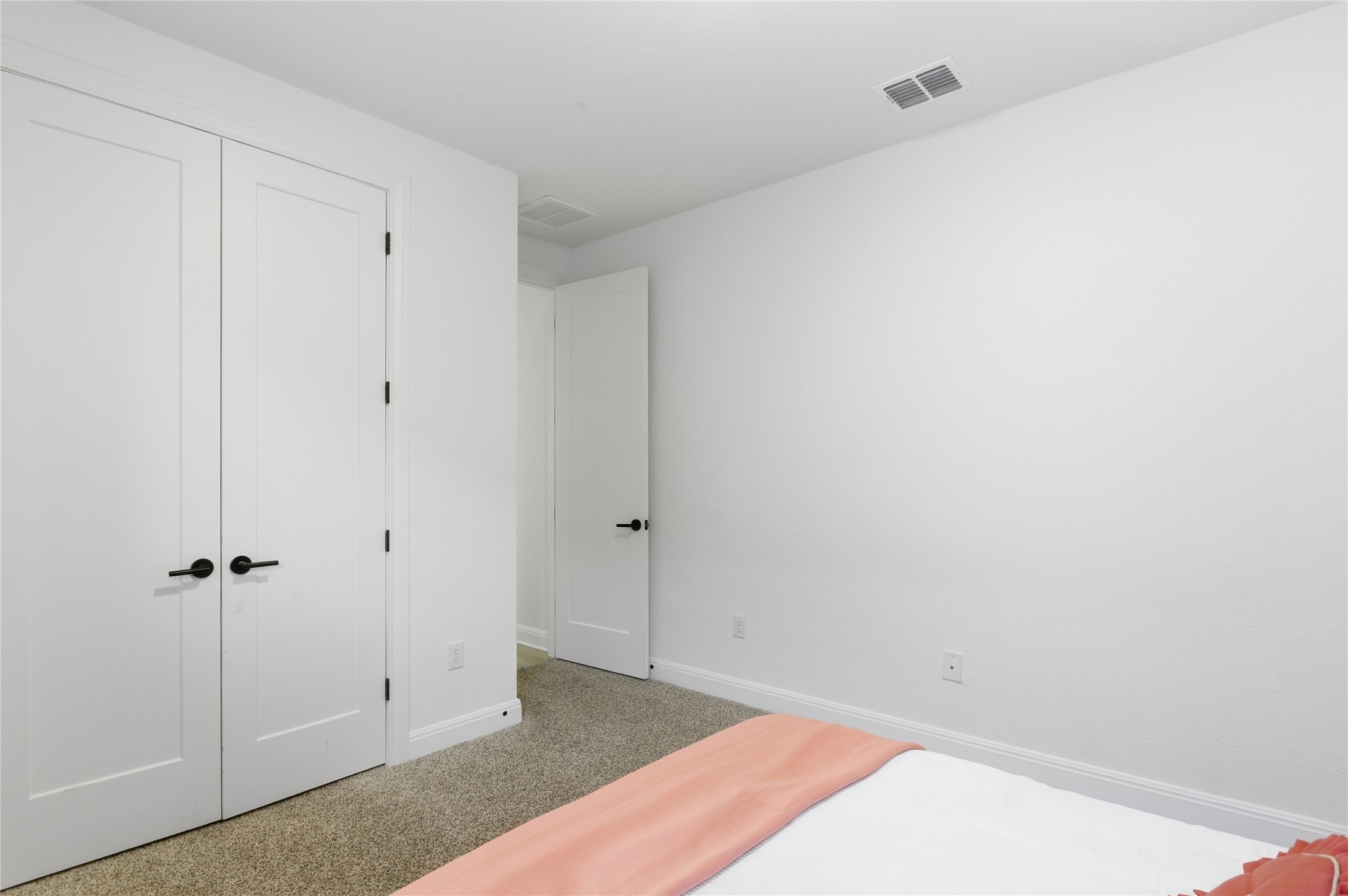 2032 Rushing Ranch Path Georgetown, TX 78628 - Photo 23 of 30 Soft carpeting underfoot and crisp white walls define this comfortable bedroom retreat.