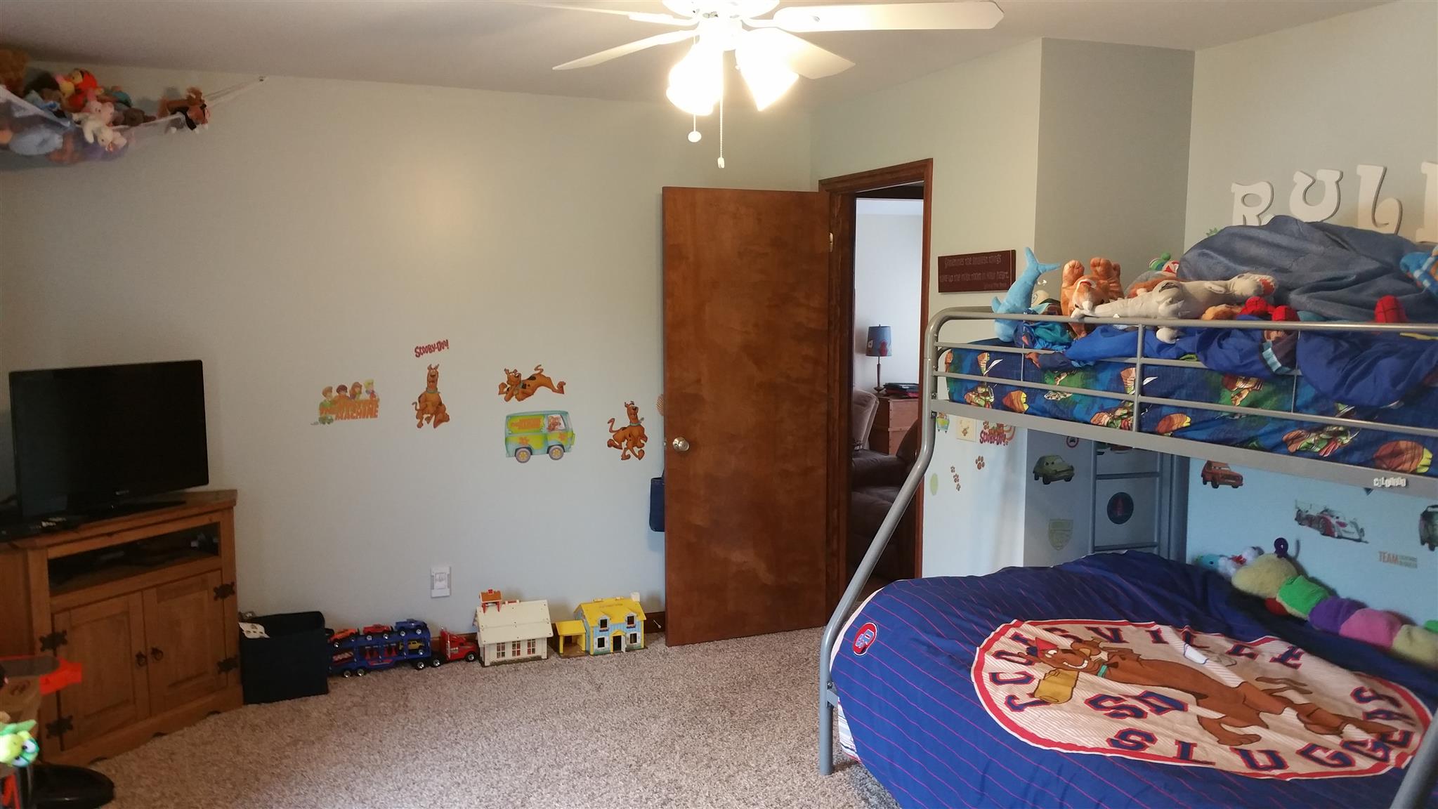 155 Knights Church Road Decherd, TN 37324 - Photo 14 of 29 a bed room with a bed and a television