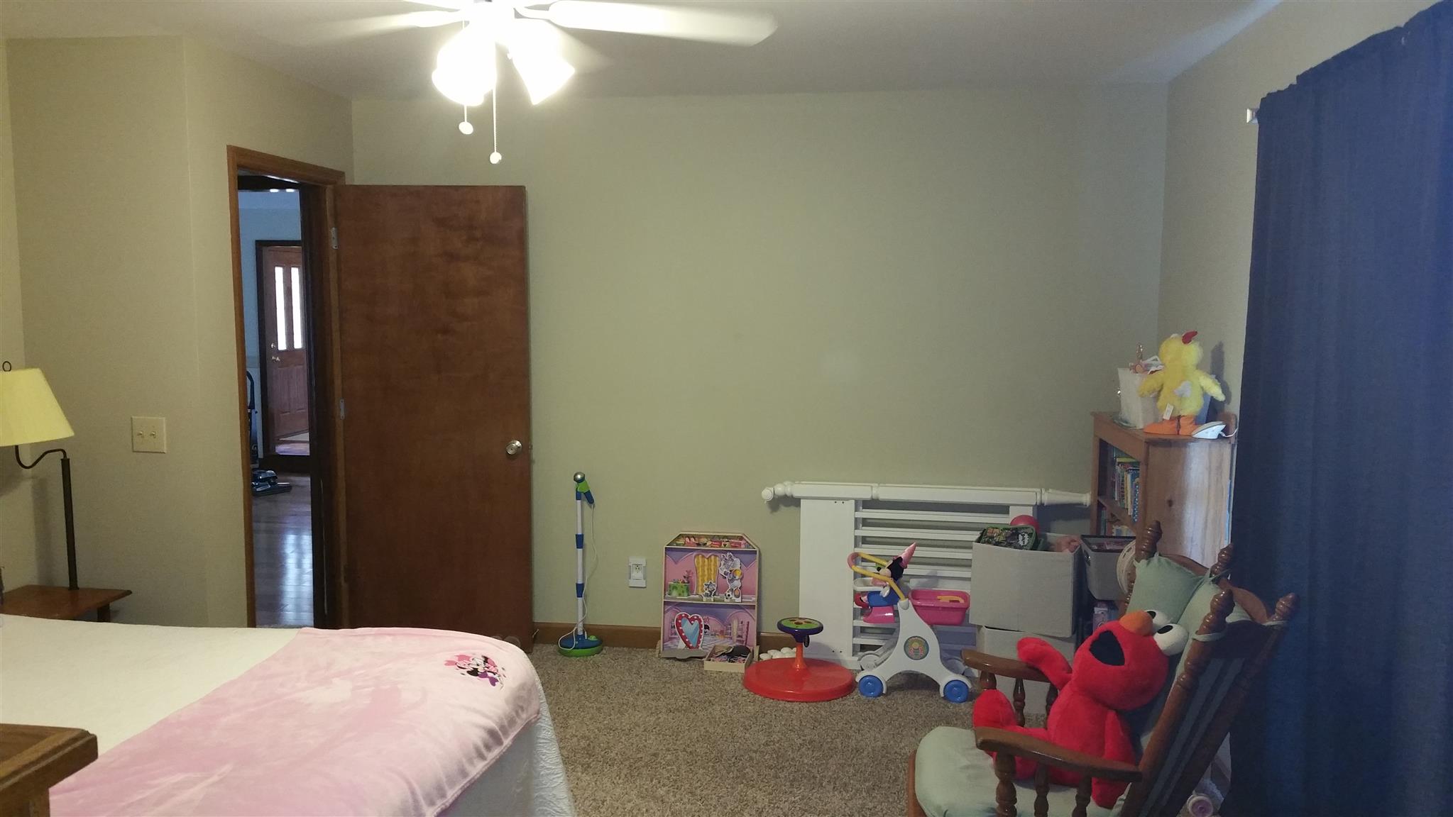 155 Knights Church Road Decherd, TN 37324 - Photo 16 of 29 a bedroom with a bed and a chandelier