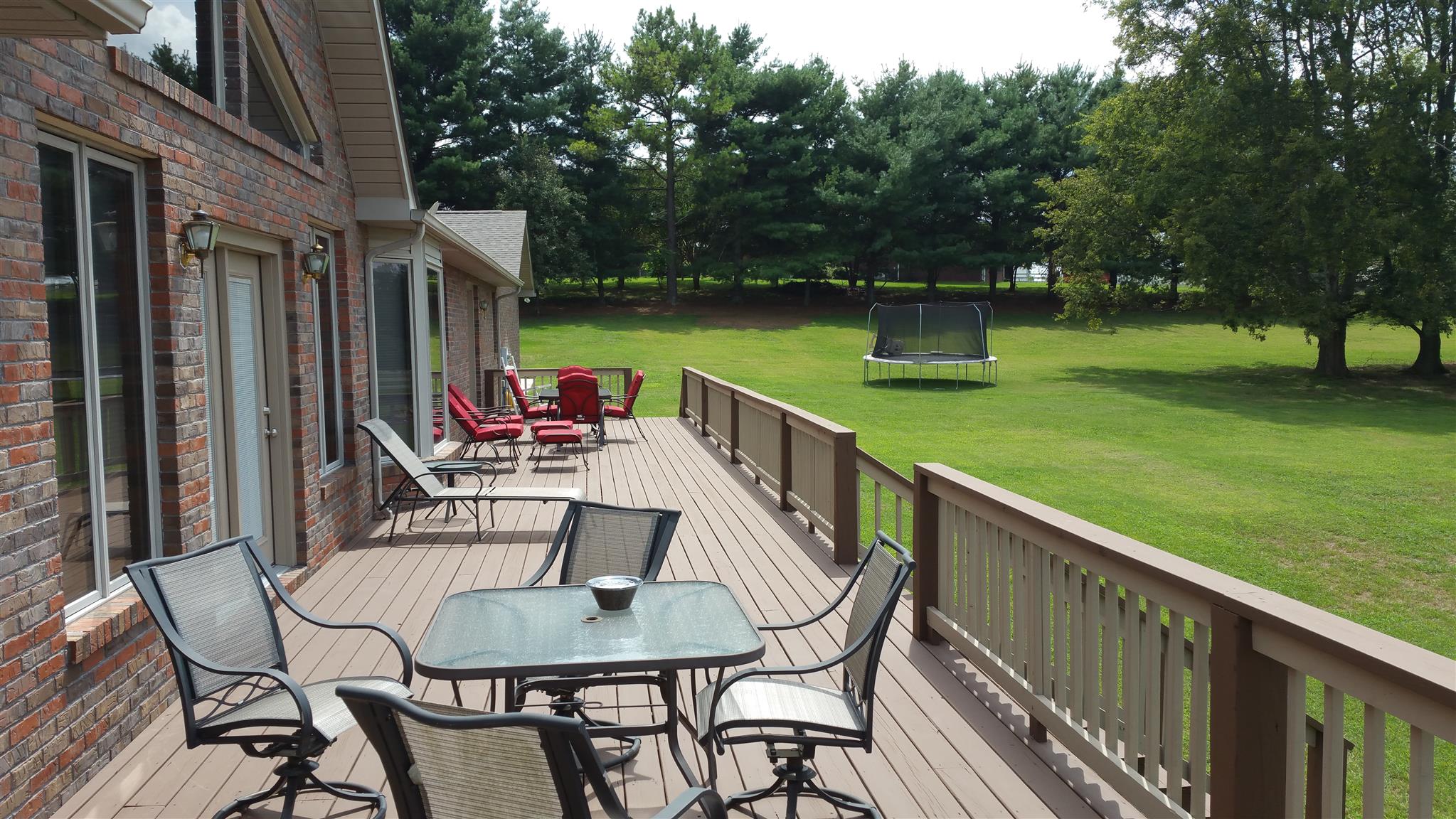 155 Knights Church Road Decherd, TN 37324 - Photo 17 of 29 a view of a chairs and table in patio with a yard