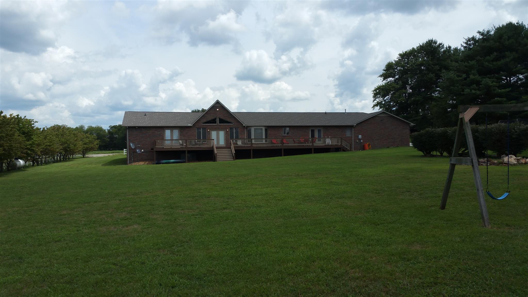 155 Knights Church Road Decherd, TN 37324 - Photo 20 of 29 a view of big yard with a house in the background