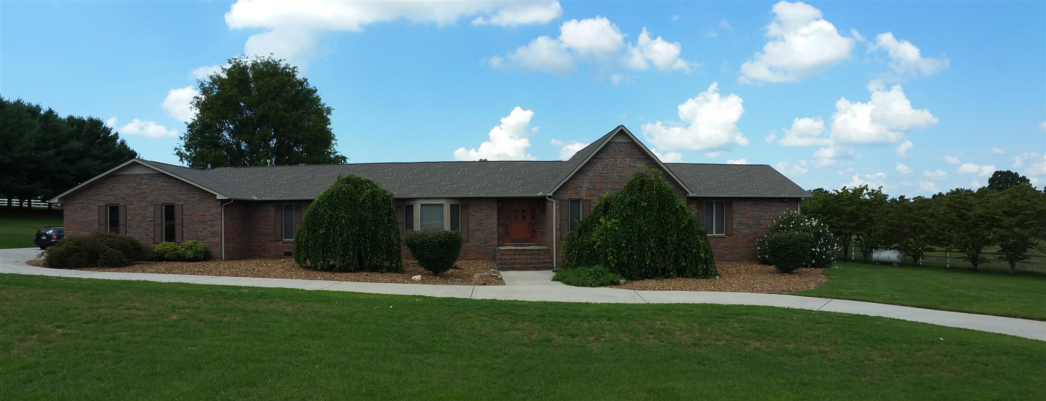 155 Knights Church Road Decherd, TN 37324 - Photo 2 of 29 a view of a house with yard and a garden