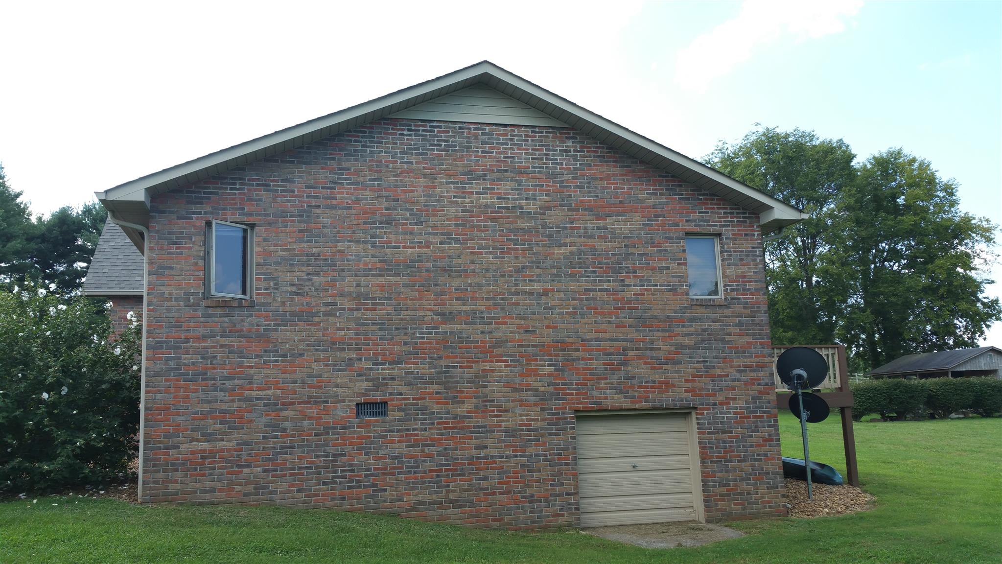 155 Knights Church Road Decherd, TN 37324 - Photo 29 of 29 a brick house with a small yard