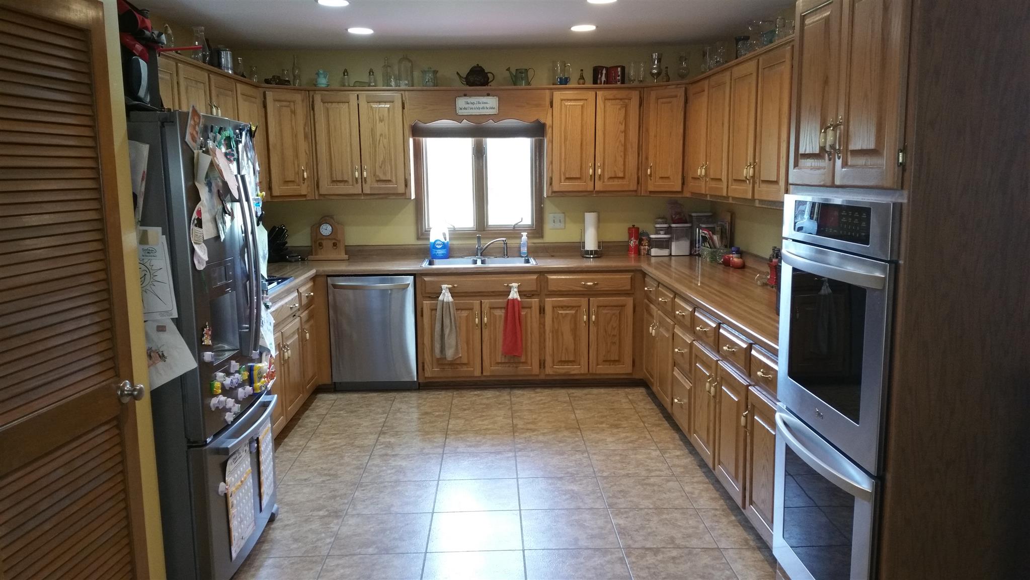 155 Knights Church Road Decherd, TN 37324 - Photo 4 of 29 a kitchen with stainless steel appliances granite countertop a stove a sink and a refrigerator