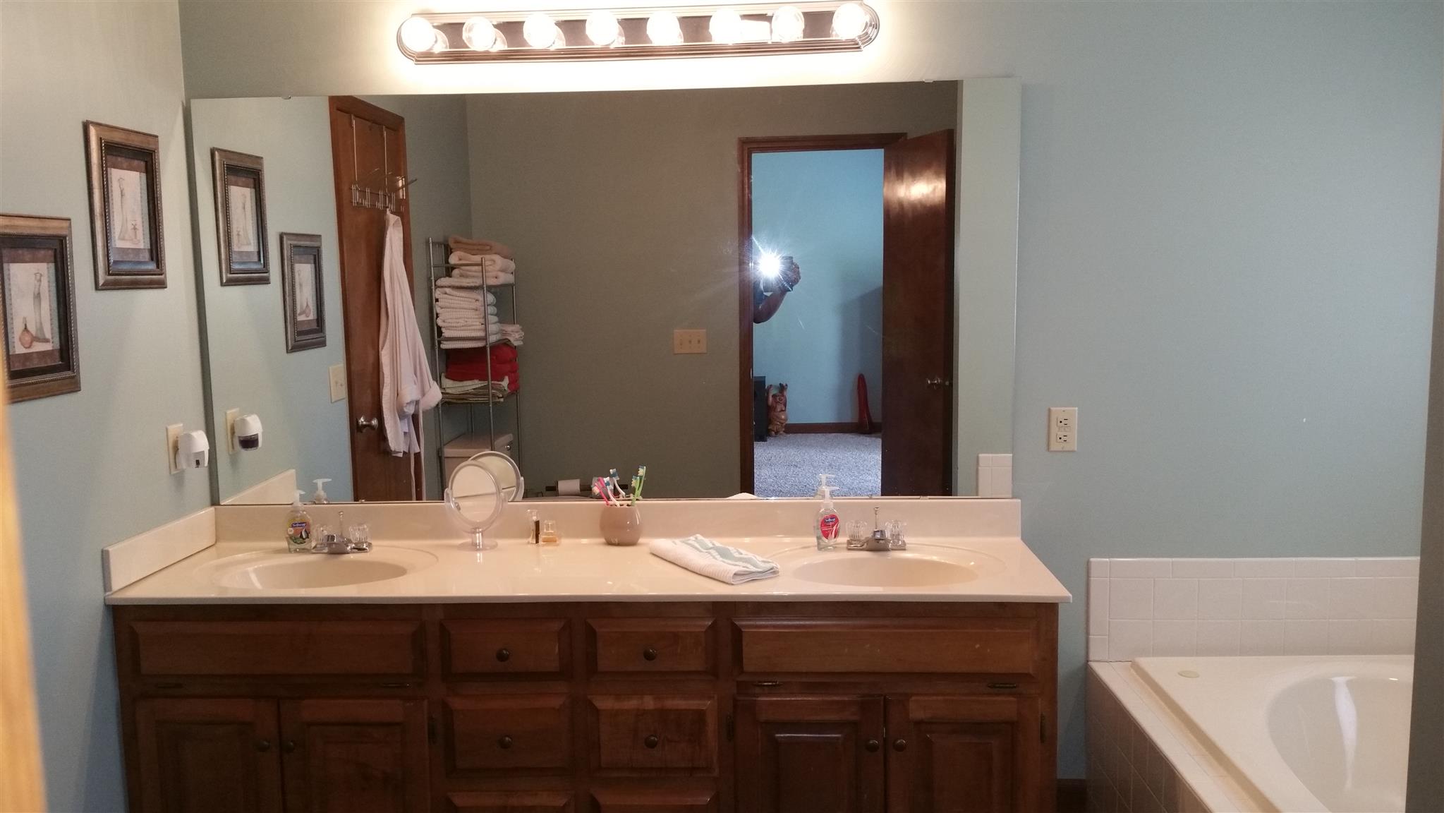 155 Knights Church Road Decherd, TN 37324 - Photo 10 of 29 a bathroom with a sink and a mirror