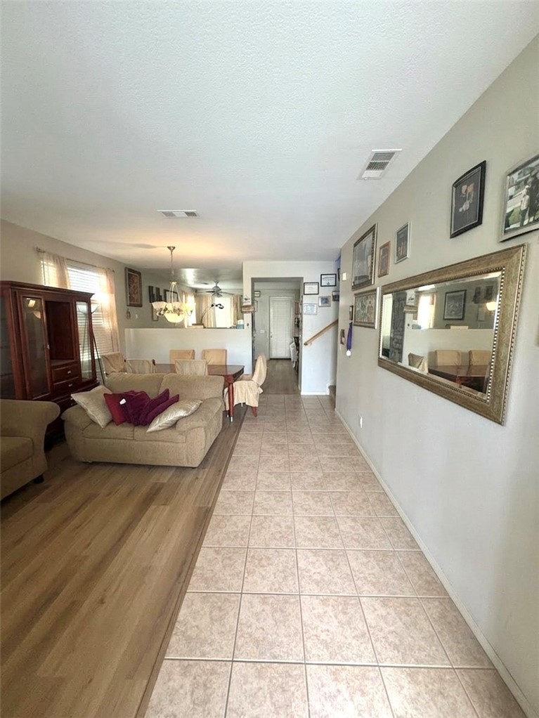 643 Canyon Crest Road Beaumont, CA 92223 - Photo 2 of 6 a living room with furniture and a flat screen tv