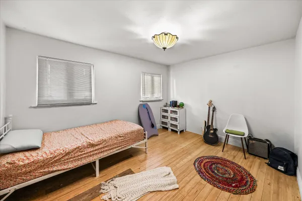 a bedroom with bed and a window