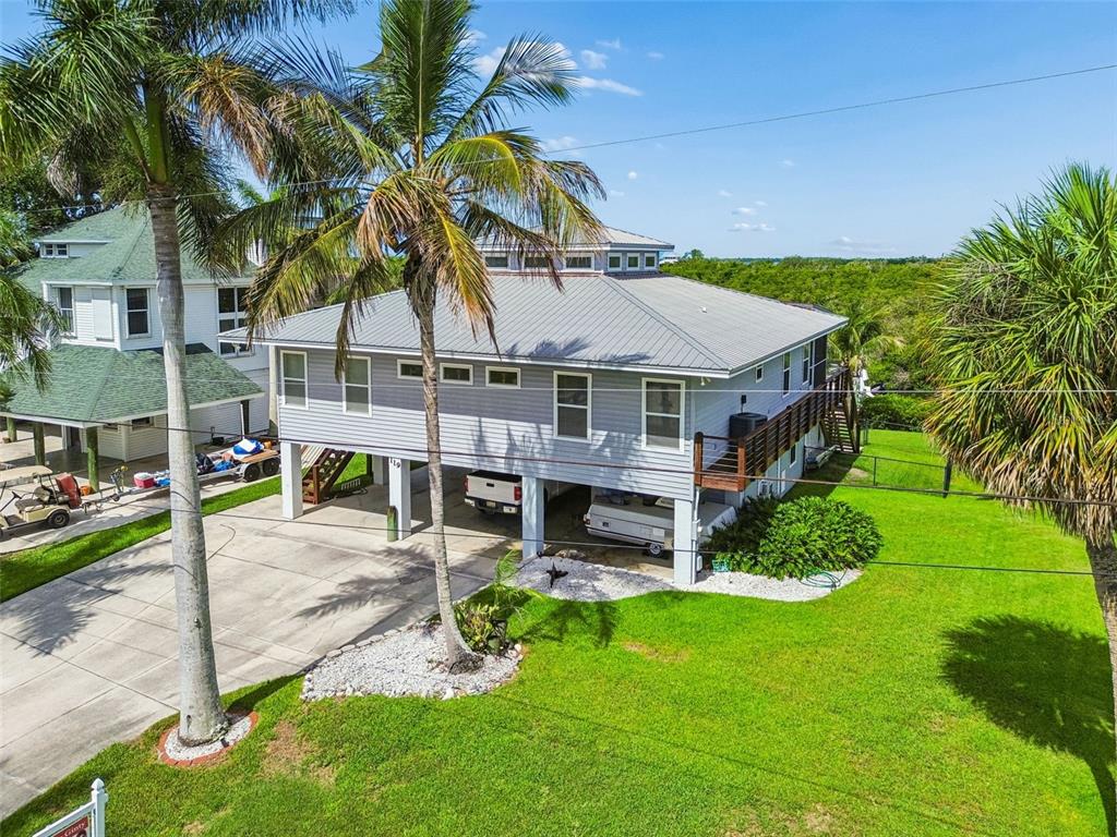 119 Burns Road Terra Ceia, FL 34250 - Photo 89 of 100 a aerial view of a house with a yard