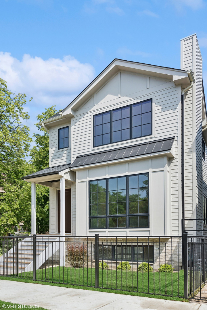 1850 West Cuyler Avenue Chicago, IL 60613 - Photo 1 of 58 a front view of a house with a yard