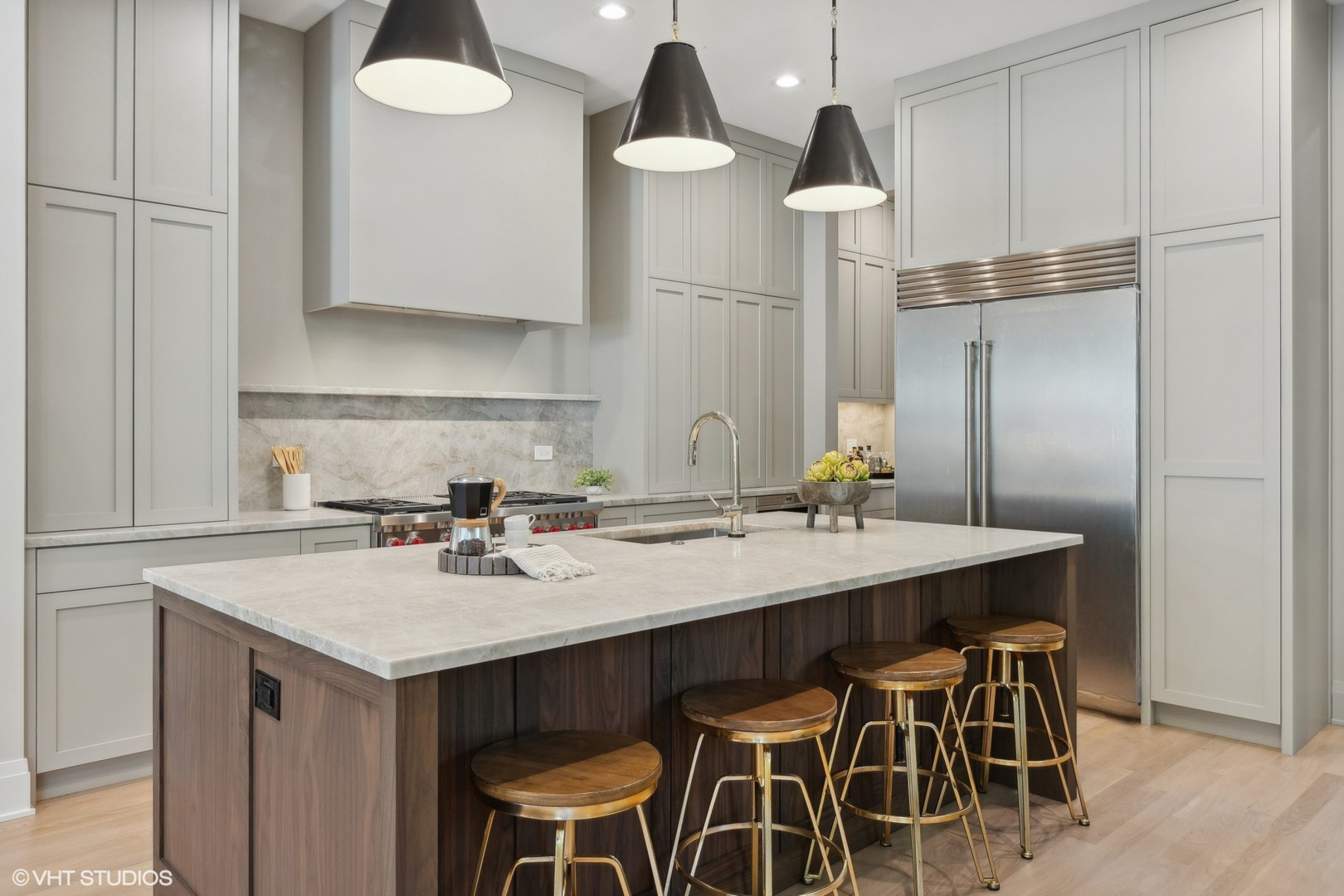 1850 West Cuyler Avenue Chicago, IL 60613 - Photo 13 of 58 a kitchen with a dining table chairs and white cabinets