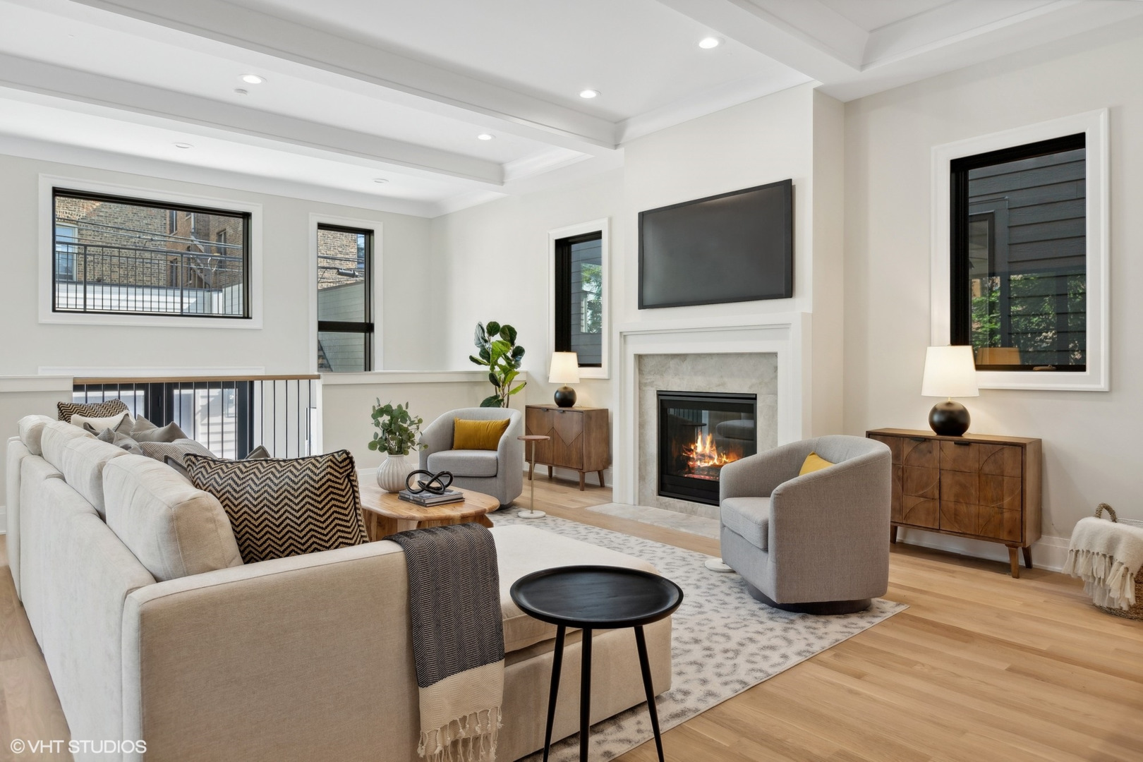 1850 West Cuyler Avenue Chicago, IL 60613 - Photo 18 of 58 a living room with furniture fireplace and a flat screen tv