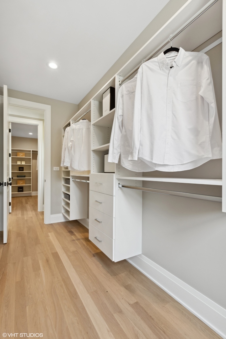 1850 West Cuyler Avenue Chicago, IL 60613 - Photo 28 of 58 a view of walk in closet with clothes and shoes