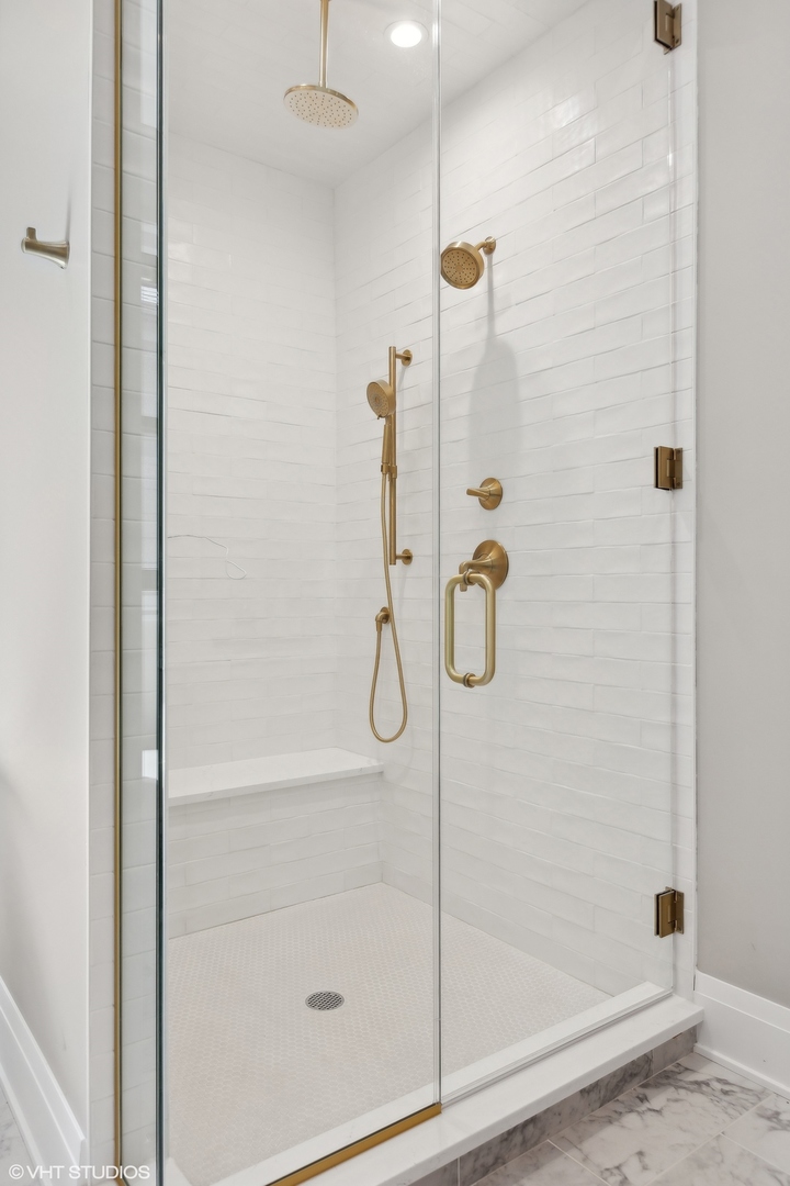 1850 West Cuyler Avenue Chicago, IL 60613 - Photo 31 of 58 a bathroom with a glass shower door