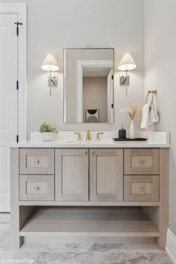 1850 West Cuyler Avenue Chicago, IL 60613 - Photo 35 of 58 a bathroom with a sink vanity and a mirror