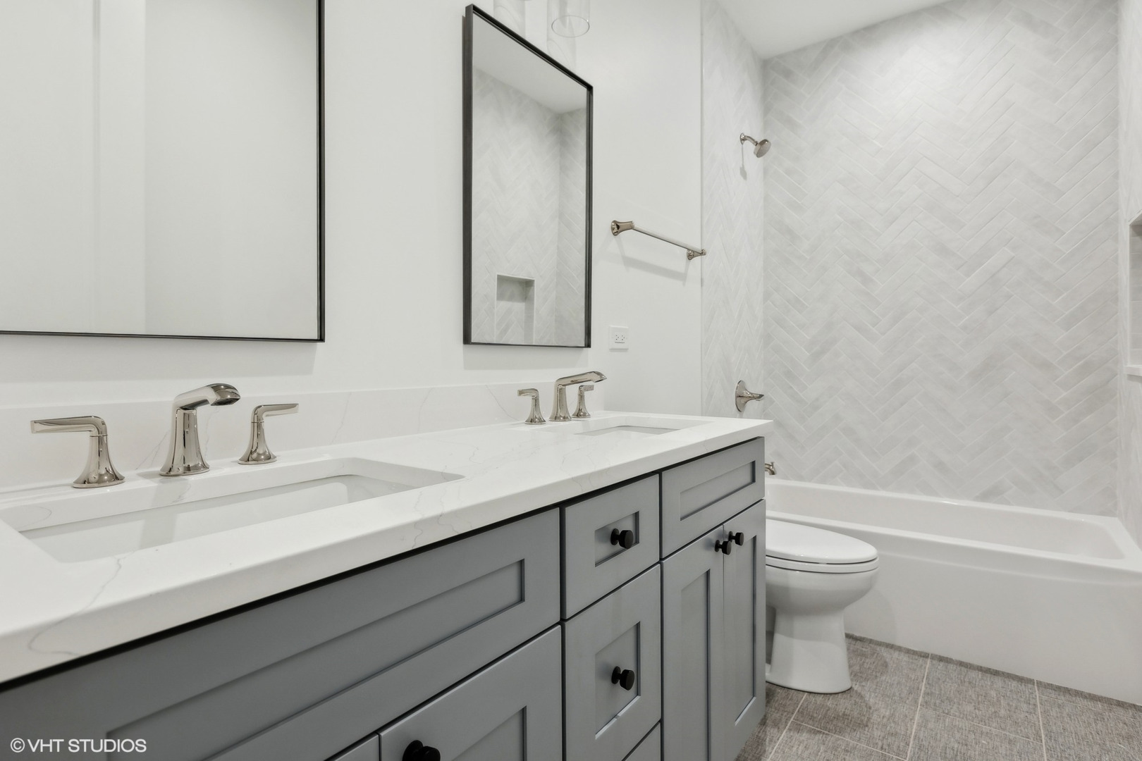 1850 West Cuyler Avenue Chicago, IL 60613 - Photo 40 of 58 a bathroom with a granite countertop sink a toilet and a bathtub