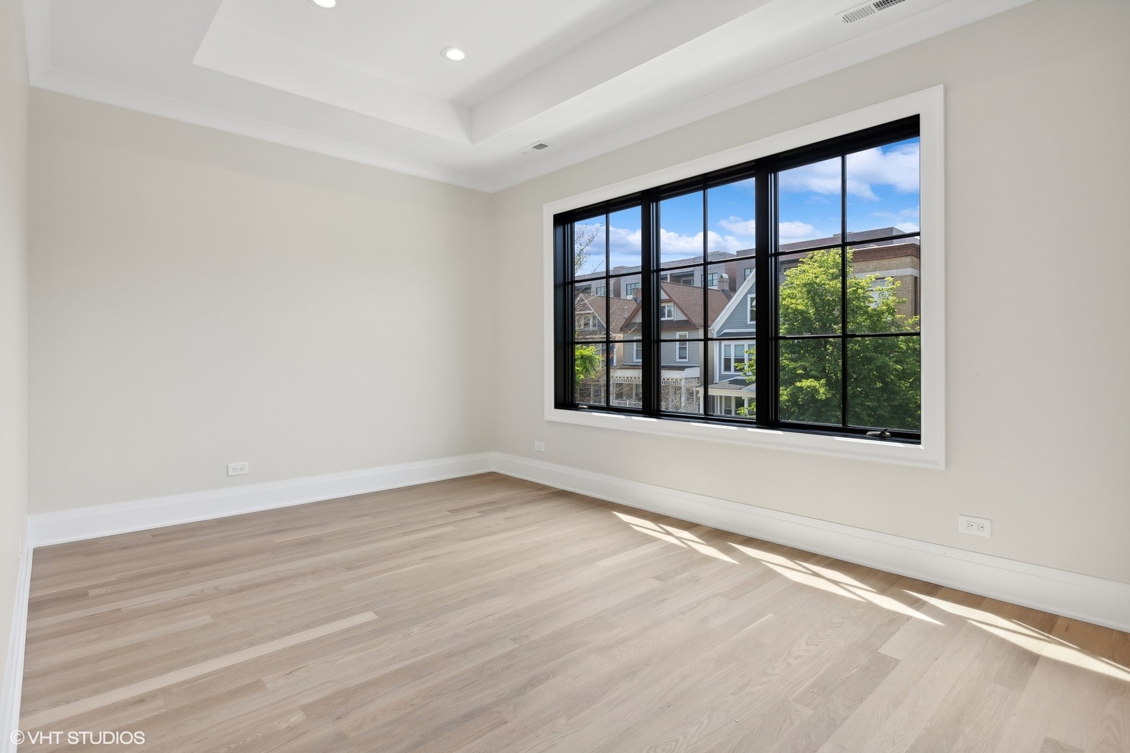 1850 West Cuyler Avenue Chicago, IL 60613 - Photo 42 of 58 an empty room with wooden floor and windows