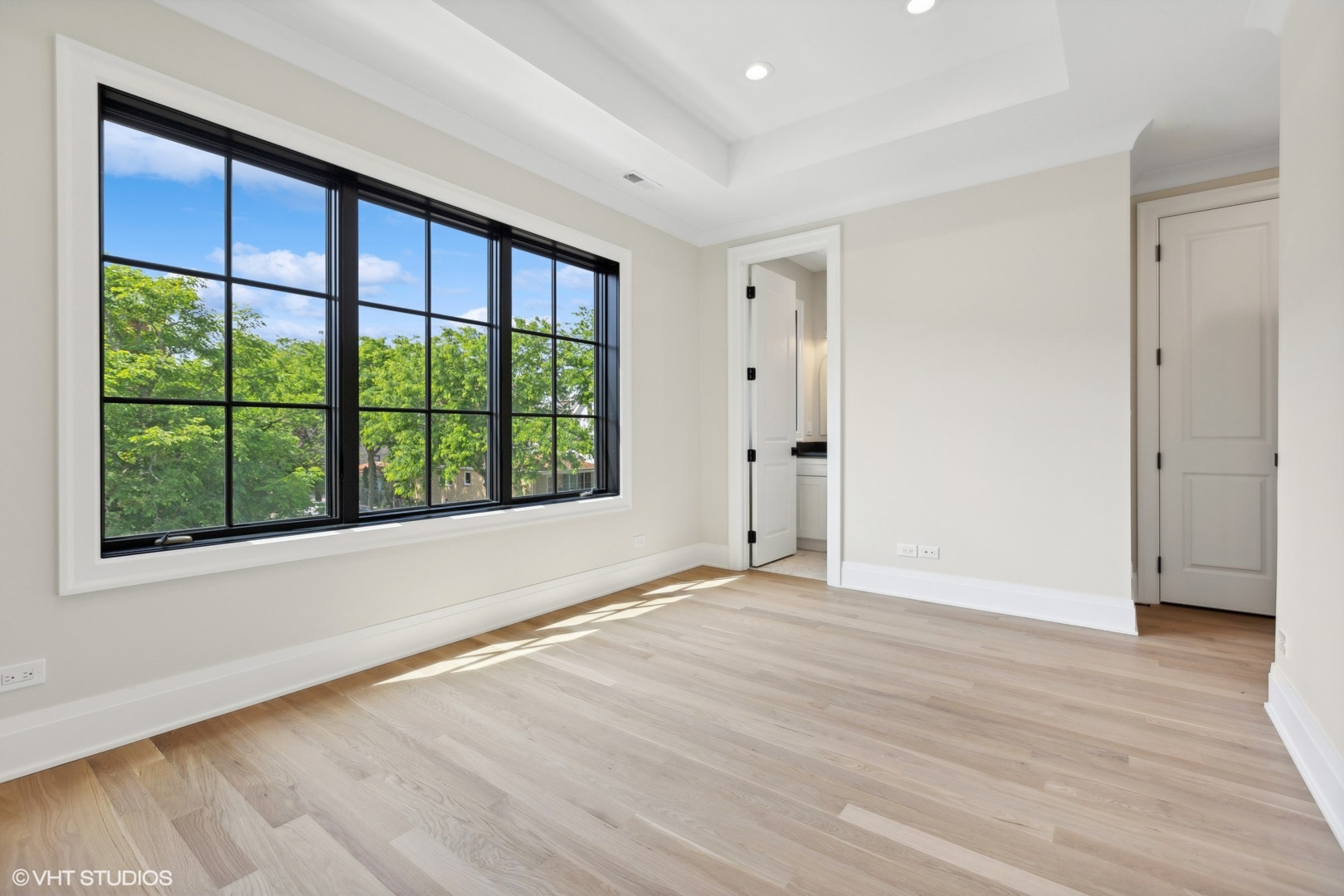 1850 West Cuyler Avenue Chicago, IL 60613 - Photo 43 of 58 a view of an empty room with wooden floor and a window