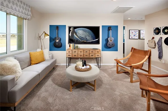 a living room with furniture and a rug