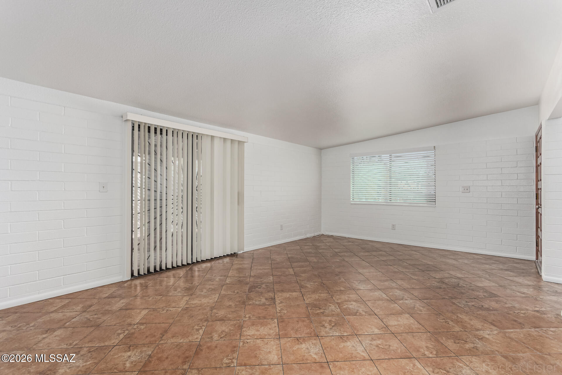 17 East Los Reales Road Tucson, AZ 85756 - Photo 7 of 27 a view of an empty room with a window