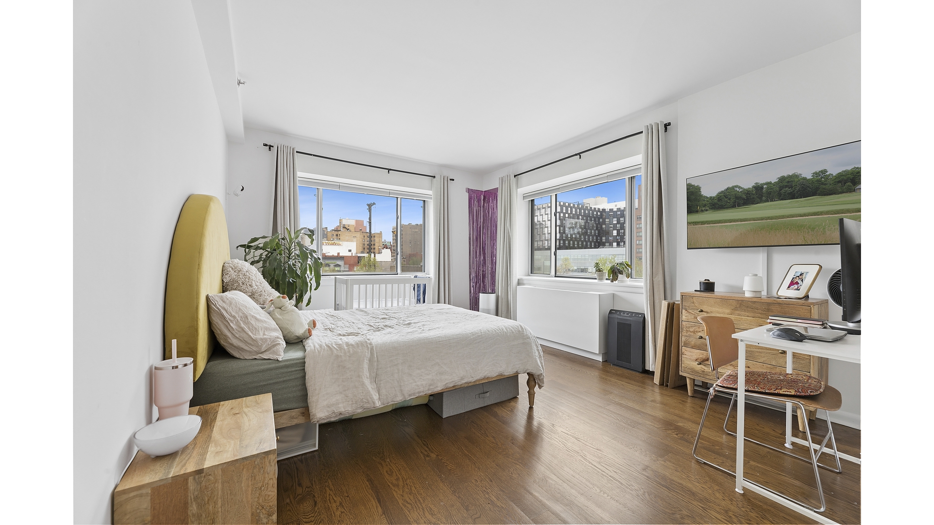 2279 3rd Avenue, Unit 3A Manhattan, NY 10035 - Photo 4 of 14 a bedroom with a bed and wooden floor