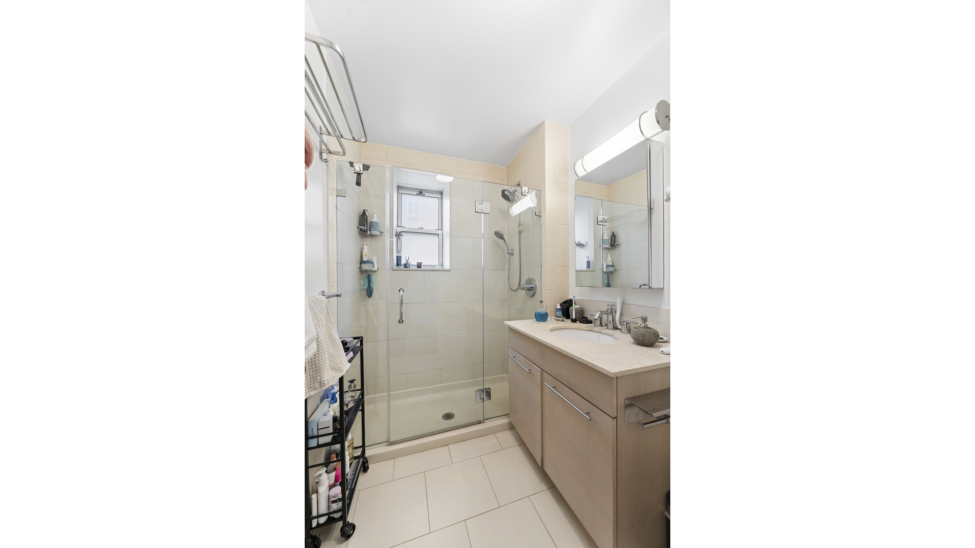 2279 3rd Avenue, Unit 3A Manhattan, NY 10035 - Photo 9 of 14 a bathroom with a sink a toilet and shower