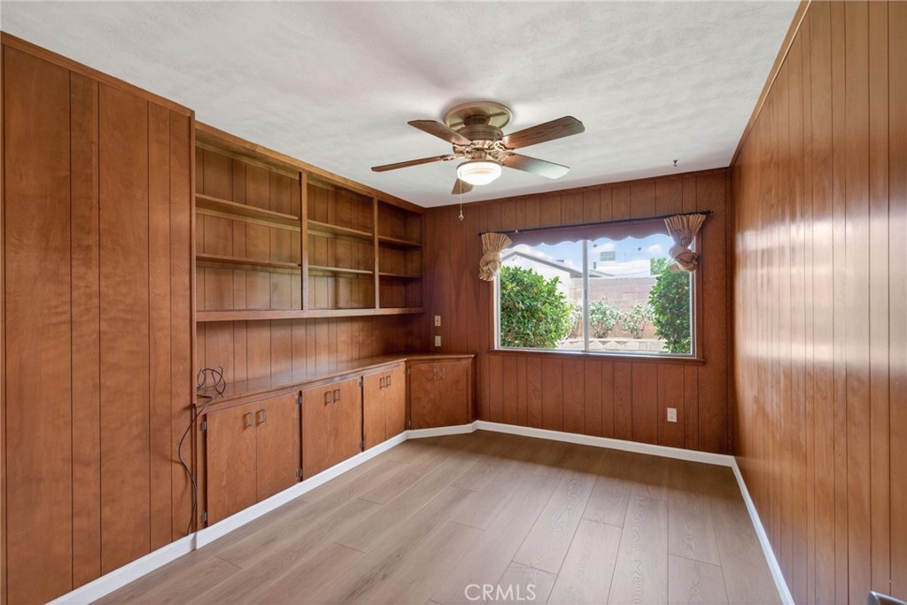 4963 Carlingford Avenue Riverside, CA 92504 - Photo 22 of 33 a view of an empty room with a window and wooden floor