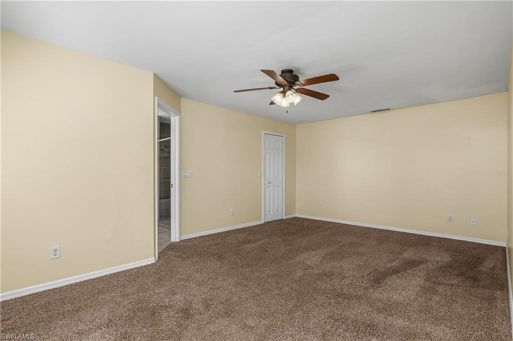 2905 Northeast 1st Place Cape Coral, FL 33909 - Photo 10 of 32 a view of room with a ceiling fan