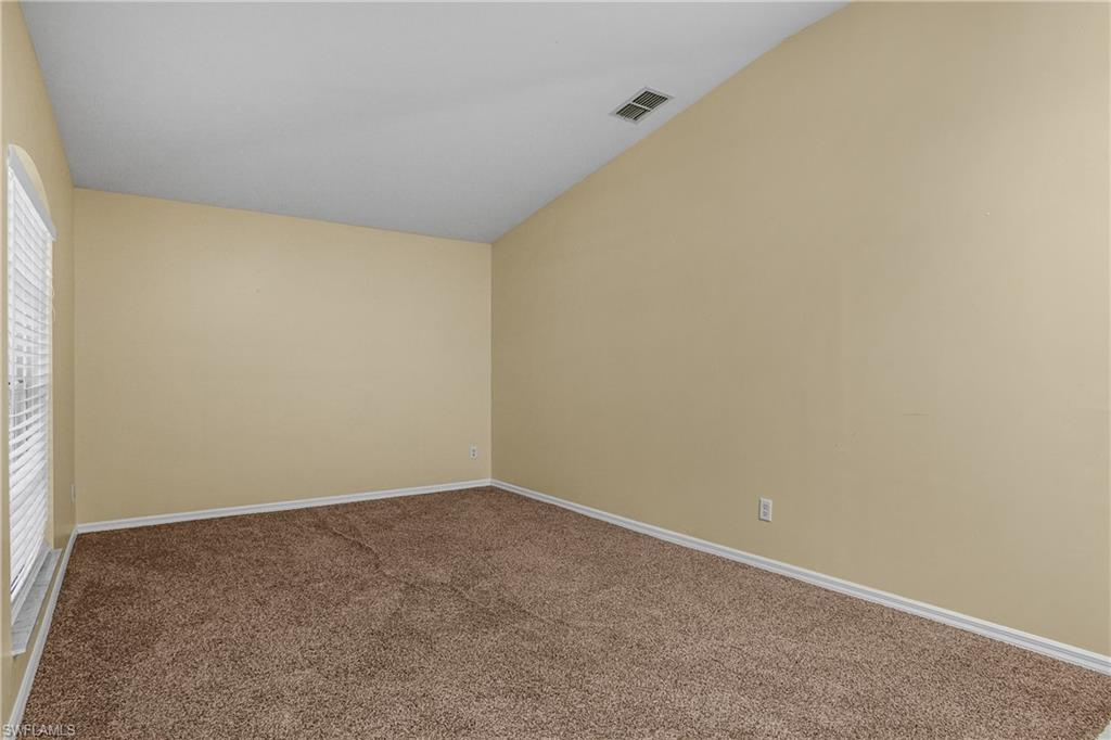 2905 Northeast 1st Place Cape Coral, FL 33909 - Photo 18 of 32 an empty room with a empty space and window