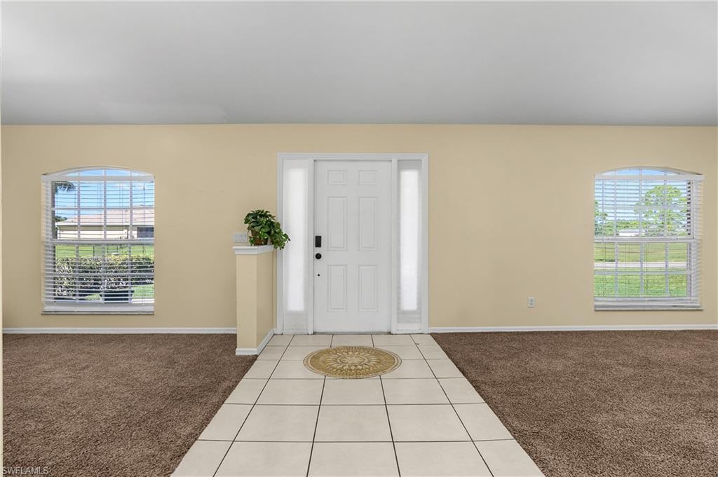 2905 Northeast 1st Place Cape Coral, FL 33909 - Photo 20 of 32 a view of an empty room with window