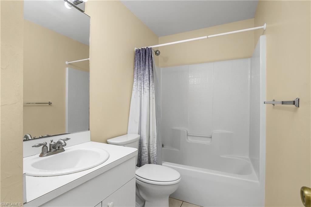 2905 Northeast 1st Place Cape Coral, FL 33909 - Photo 21 of 32 a bathroom with a sink toilet and shower