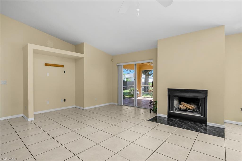 2905 Northeast 1st Place Cape Coral, FL 33909 - Photo 23 of 32 a view of an empty room with window and fire place