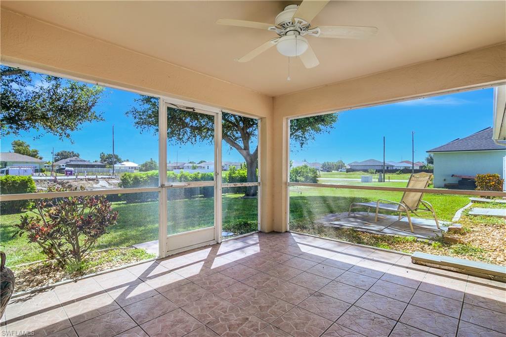 2905 Northeast 1st Place Cape Coral, FL 33909 - Photo 25 of 32 a view of a room with wooden floor and a yard