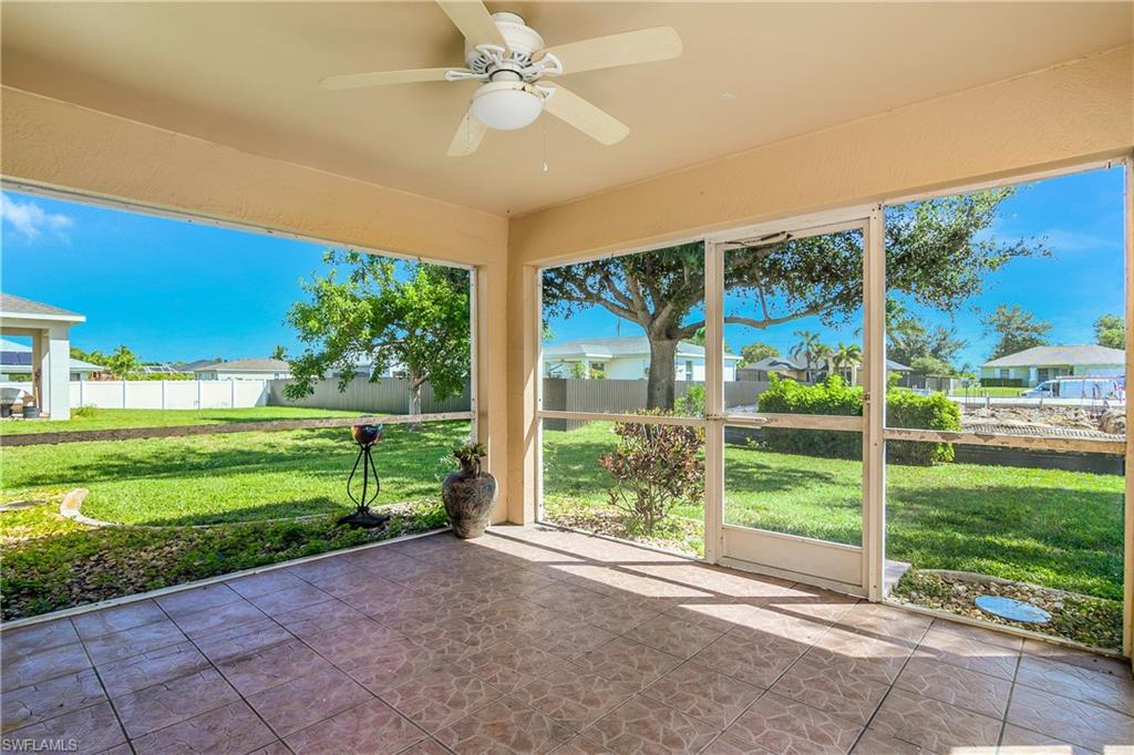 2905 Northeast 1st Place Cape Coral, FL 33909 - Photo 26 of 32 a view of a porch with a yard